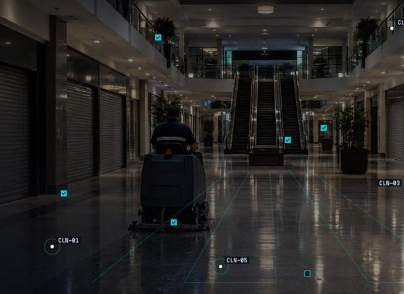 Overnight cleaning shift with a ride-on scrubber in a shopping centre concourse (illustrative)